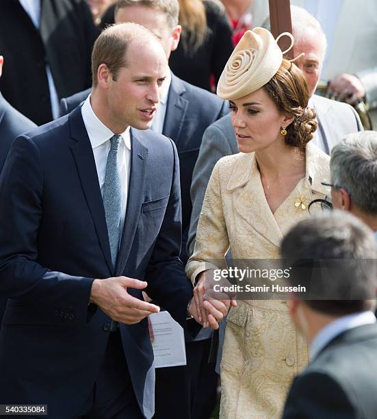 Catherine, Duchess of Cambridge and Prince William, Duke of Cambridge hold hands as they attend the Secretary of State's annual Garden party at...