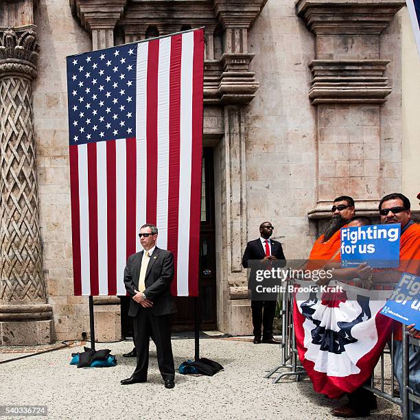 Secret Service and supporters wait for the arrival of Democratic presidential candidate Hillary Clinton during a campaign rally at La Fachada Plaza...