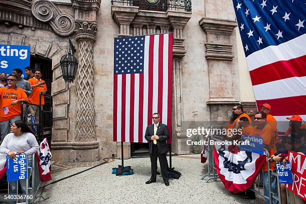 Secret Service and supporters wait for the arrival of Democratic presidential candidate Hillary Clinton during a campaign rally at La Fachada Plaza...