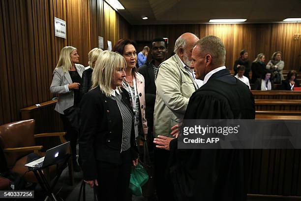 South African chief state prosecutor Gerrie Nel speaks with Reeva Steenkamp's family members during the third day of South African Paralympian Oscar...