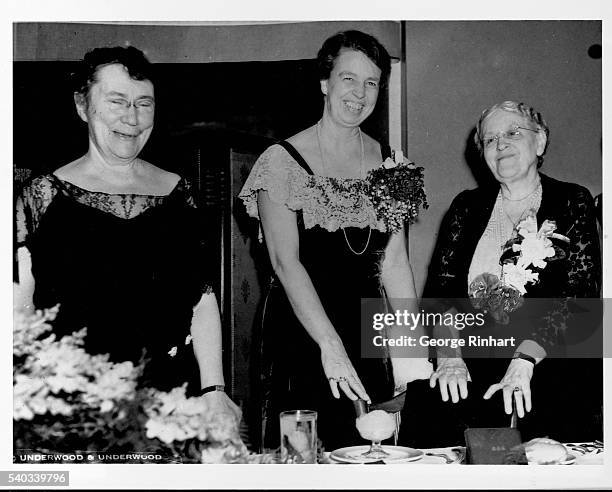 Mount Holyoke President Mary E. Woolley, First Lady Eleanor Roosevelt, and suffragist Carrie Chapman Catt attend a banquet at the Washington Hotel...