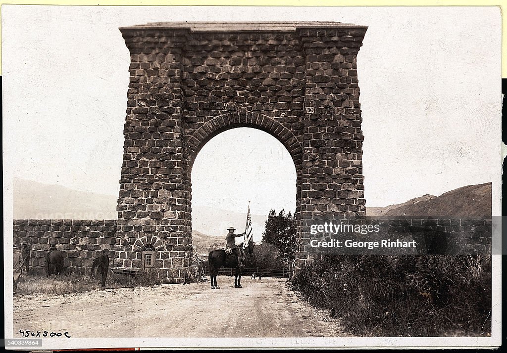 Horseback Ranger Carrying Flag in Arch
