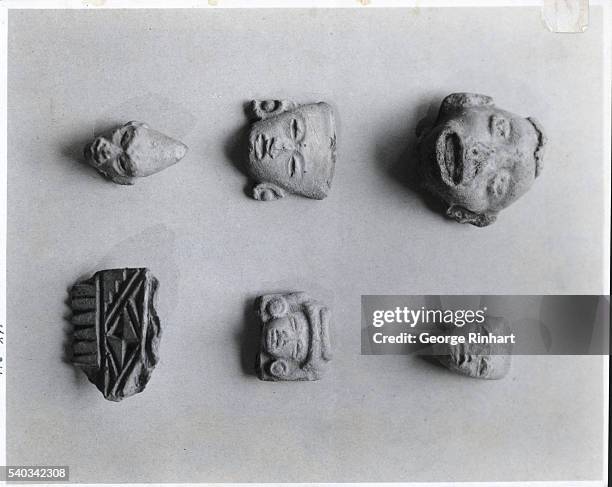 Small carvings of faces found at the Temple of Quetzalcoatl.