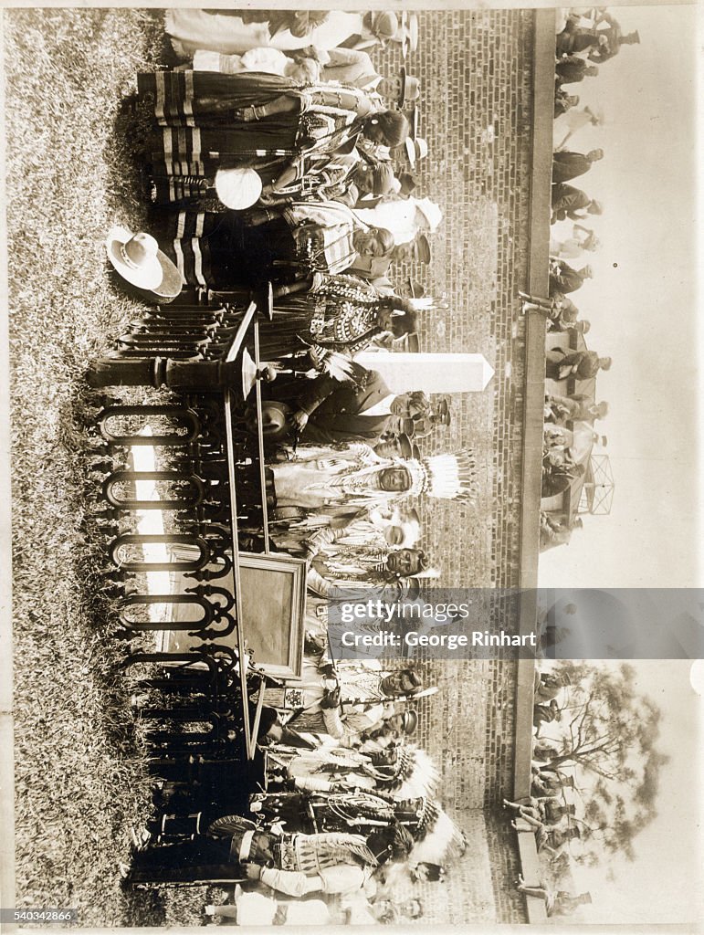Native Am Group Standing Over Grave