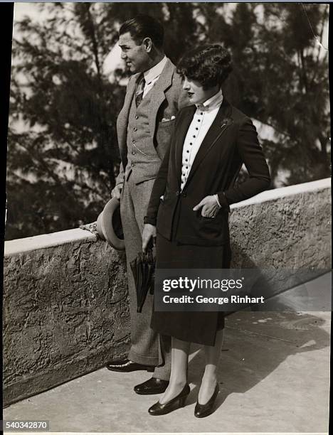 Miami Beach, FL: Jack and Mrs. Dempsey, the former Estelle Taylor, movie star, on the roof of the Fleetwood Hotel, Miami Beach, Florida, looking out...