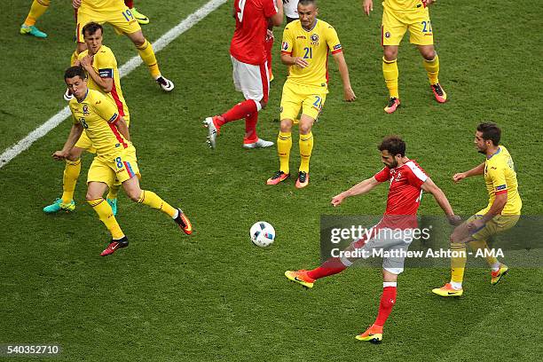 Admir Mehmedi of Switzerland scores a goal to make the score 1-1 during the UEFA EURO 2016 Group A match between Romania and Switzerland at Parc des...