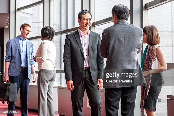 business folk group talks in the business hall,kyoto,japan - japanese exit sign stock pictures, royalty-free photos & images