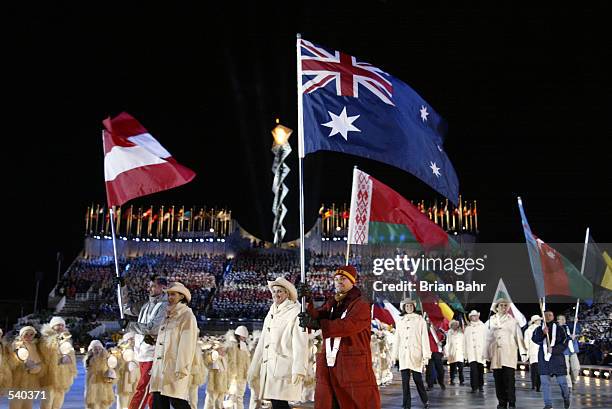 Steven Bradbury of Australia enters the stadium during the Closing Ceremony of the Salt Lake City Winter Olympic Games at the Rice-Eccles Olympic...