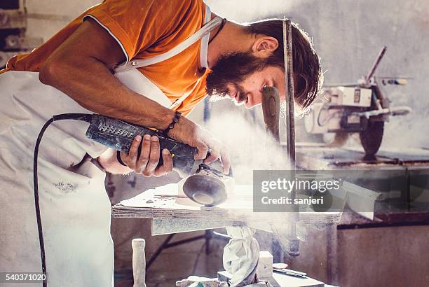 stonecutter at work - job cuts stock pictures, royalty-free photos & images