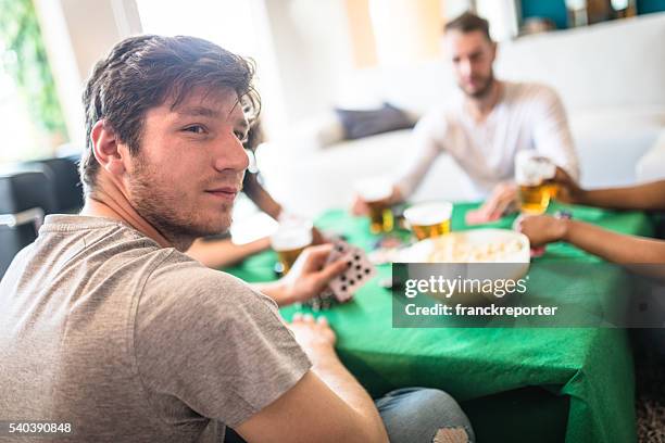 drinking and playing poker - texas hold 'em stock pictures, royalty-free photos & images