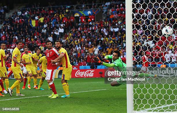 Ciprian Tatarusanu of Romania is beaten by the shot of Admir Mehmedi of Switzerland during the UEFA EURO 2016 Group A match between Romania and...