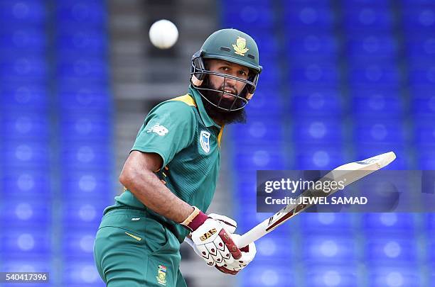 South African cricketer Hashim Amla plays a shot during the 6th One Day International match of the Tri-nation Series between West Indies and South...