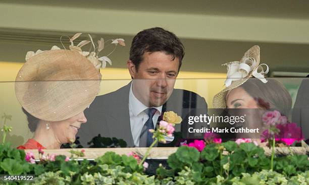 Crown Princess Mary of Denmark and Crown Prince Frederik of Denmark with Catherine, Duchess of Cambridge watch the racing on day 2 of Royal Ascot at...