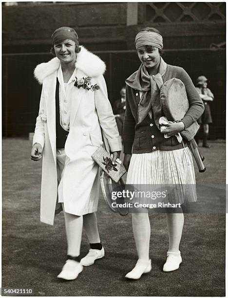 Miss Betty Nuthall defeated Fraulein Aussem, the German woman champion, at Wimbledon, on Wednesday. The two players coming out for their match.