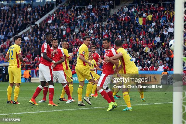 Admir Mehmedi of Switzerland scores his sides first goal during the UEFA Euro 2016 Group A match between Romania and Switzerland at Parc des Princes...