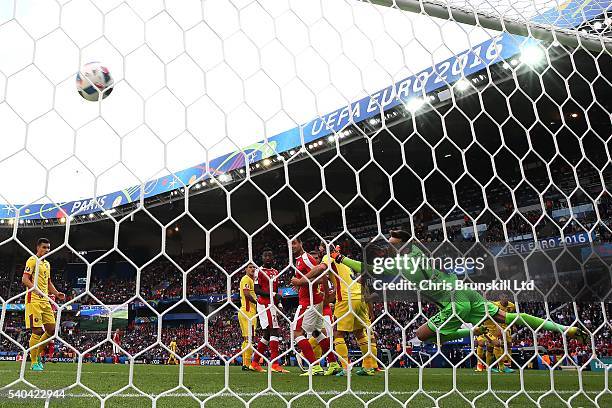 Admir Mehmedi of Switzerland scores his sides first goal during the UEFA Euro 2016 Group A match between Romania and Switzerland at Parc des Princes...