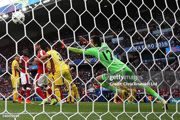 Admir Mehmedi of Switzerland scores his sides first goal during the UEFA Euro 2016 Group A match between Romania and Switzerland at Parc des Princes...