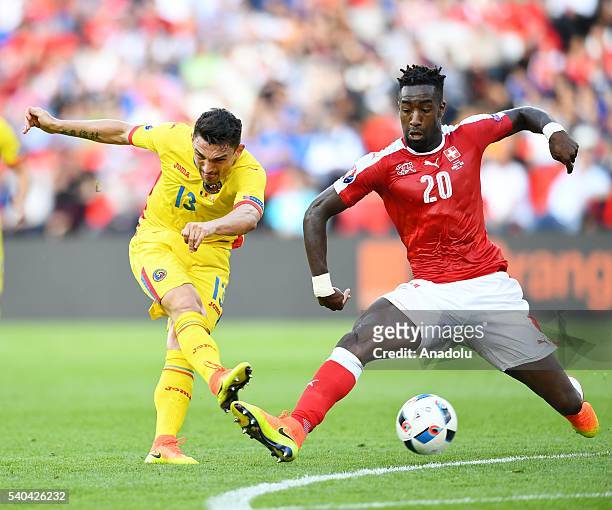 Johan Djourou of Switzerland in action against Claudiu Keseru of Romania during the UEFA Euro 2016 Group A match between Romania and Switzerland at...
