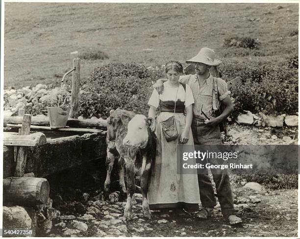 Swiss Couple Posing with Cow