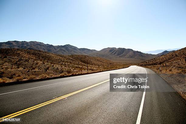 endless street in the desert mountain - empty road stock pictures, royalty-free photos & images