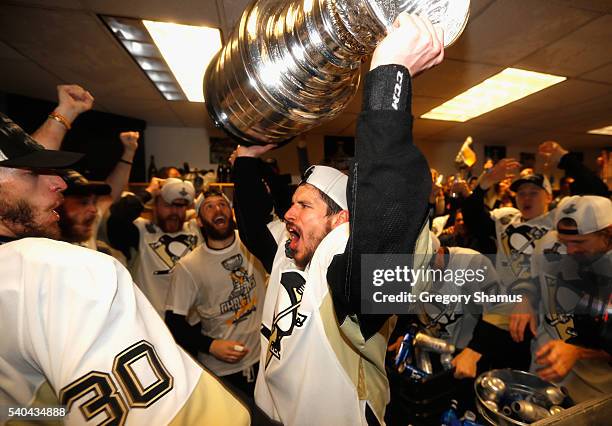 Sidney Crosby of the Pittsburgh Penguins celebrates with the Stanley Cup in the locker room after winning Game 6 of the 2016 NHL Stanley Cup Final...