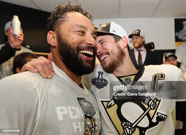 Trevor Daley and Sidney Crosby of the Pittsburgh Penguins celebrate with the Stanley Cup in the locker room after winning Game 6 of the 2016 NHL...