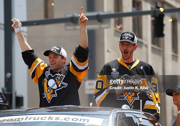 Bryan Rust and Matt Murray of the Pittsburgh Penguins celebrate during the Victory Parade and Rally on June 15, 2016 in Pittsburgh, Pennsylvania. The...