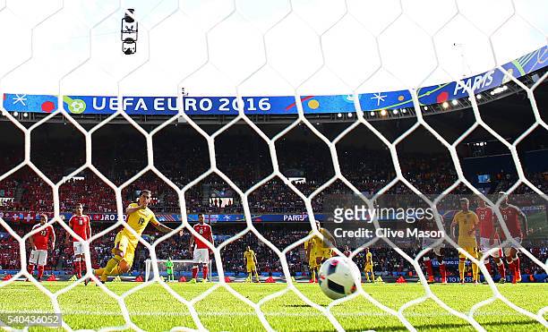 Bogdan Stancu of Romania scores his side's first goal from the penalty spot during the UEFA EURO 2016 Group A match between Romania and Switzerland...