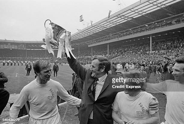 Leeds United F.C. Manager Don Revie lifts the 'FA Cup' trophy after his players beat Arsenal F.C. To win the FA Cup Final, Wembley Stadium, London,...