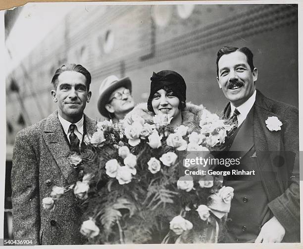 New York: Ruth Elder And Co Pilot George Haldeman Enthusiastically Greeted On Return From Attempted Transatlantic Flight. Photo Shows: Left to right,...