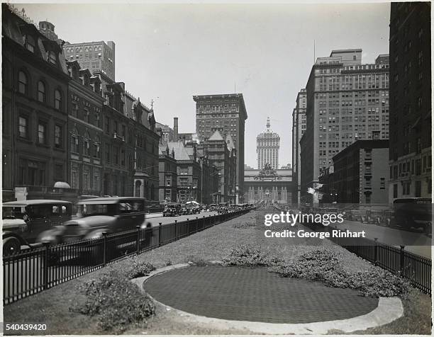 New York, New York: Looking north on Park Avenue form 38th Street showing the new New York Central Building towering above Grand Central Terminal.