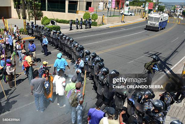 Honduras Lenca natives protest in Tegucigalpa on June 15, 2016 against the murder of indigenous environmentalist Berta Caceres last March. The...