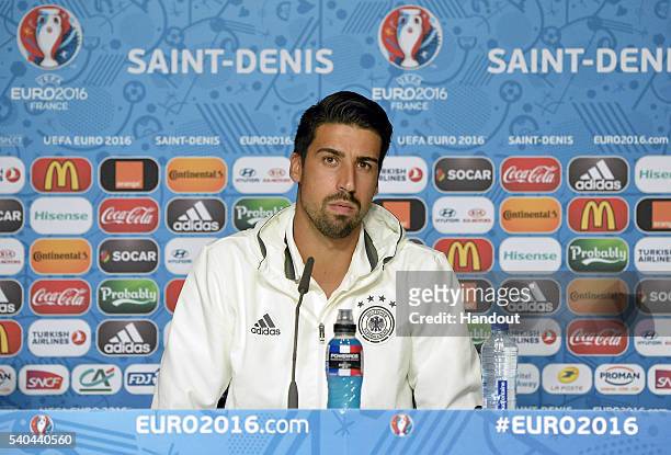 In this handout image provided by UEFA, Sami Khedira of Germany addresses the media during a Germany press conference on June 15, 2016 in Paris,...