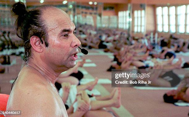 Close-up of Indian Yoga guru Bikram Choudhury as he instructs his yoga class in heated room, Beverly Hills, California, February 2, 2000.