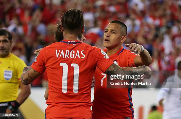 Eduardo Vargas of Chile celebrates with teammate Alexis Sanchez after scoring during a group D match between Chile and Panama at Lincoln Financial...