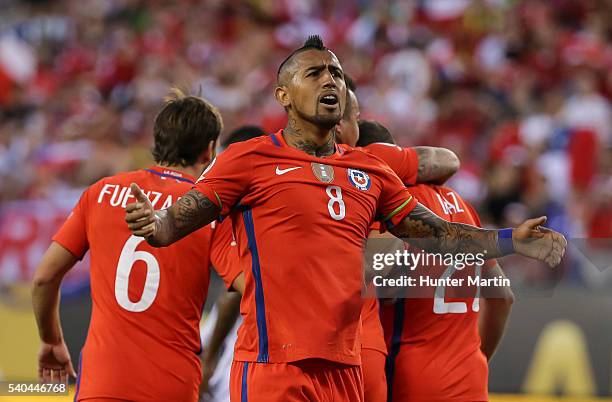 Arturo Vidal of Chile celebrates after a goal scored by his teammate Eduardo Vargas during a group D match between Chile and Panama at Lincoln...