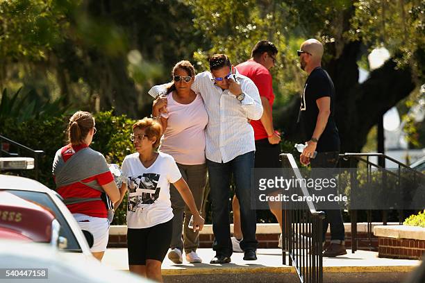 Family and friends arrive on Monday at the Senior Center at 800 Delaney St. In Orlando as they await news on their loved ones.