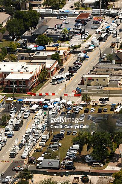 Media trucks line the street on Orange Ave. One block form where FBI investigators continue to work at the Pulse nightclub on Wednesday, June 15,...