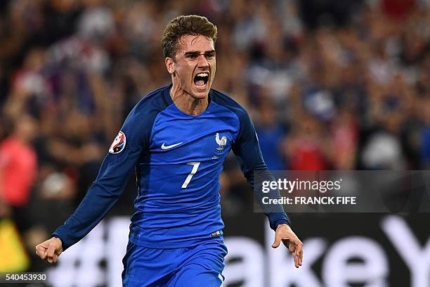 France's forward Antoine Griezmann celebrates the team's first goal during the Euro 2016 group A football match between France and Albania at the...