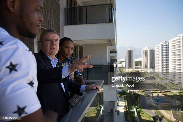 President Thomas Bach, center, talks with refugees and judo athletes from the Democratic Republic of Congo Yolande Mabika, right, and Popole Misenga...