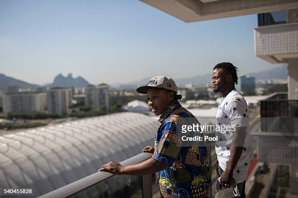 Refugees and judo athletes from the Democratic Republic of Congo Yolande Mabika, center, and Popole Misenga, right, take in the view from their...