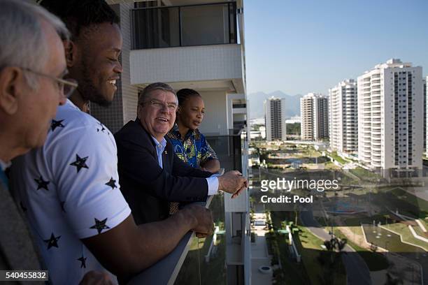 President Thomas Bach, center, talks with refugees and judo athletes from the Democratic Republic of Congo Yolande Mabika, right, and Popole Misenga...