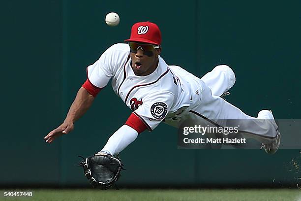 Ben Revere of the Washington Nationals misses the catch in the first inning against the Chicago Cubs at Nationals Park on June 15, 2016 in...