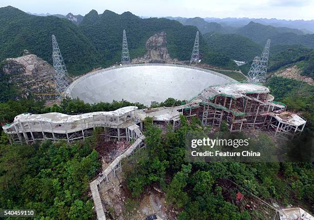 View of the Five-hundred-meter Aperture Spherical radio Telescope near its completion on June 13, 2016 in the remote Pingtang county, China. The...