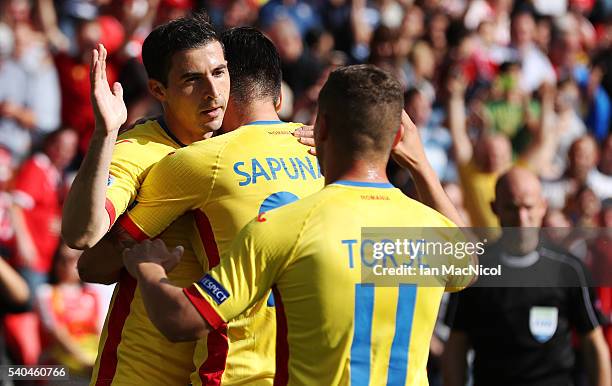 Bogdan Stancu of Romania scores the opening goal from the penalty spot during the UEFA EURO 2016 Group A match between Romania and Switzerland at...