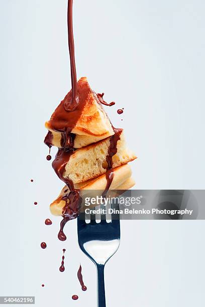 pancakes with chocolate sauce on fork - indulgence stock pictures, royalty-free photos & images