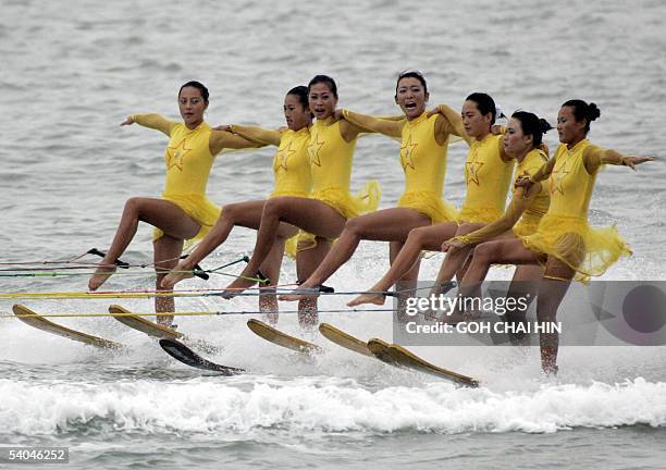 Chinese water skiing team show off their skills during a performance at the opening ceremony of the 2005 International Europe Class Yacht World...
