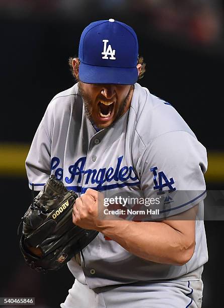 Clayton Kershaw of the Los Angeles Dodgers reacts after striking out Nick Ahmed of the Arizona Diamondbacks during the seventh inning at Chase Field...