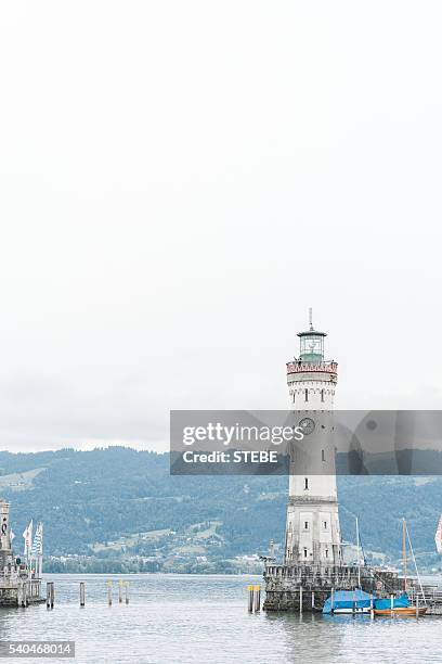 germany, bavaria, view of lighthouse at lindau - tierfigur stock pictures, royalty-free photos & images