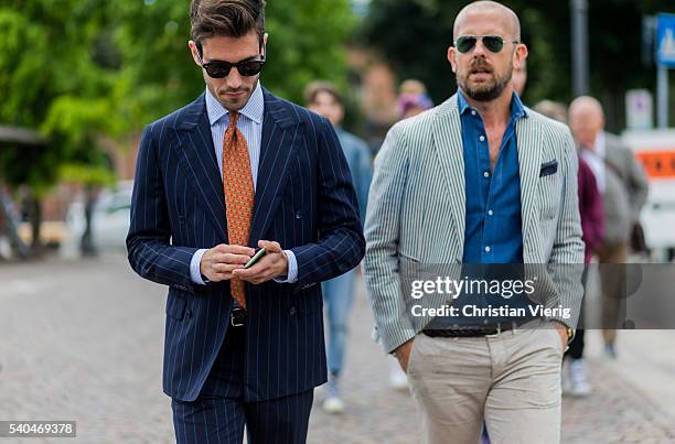 Guests wearing striped jackets during Pitti Uomo 90 on June 15 in Florence, Italy